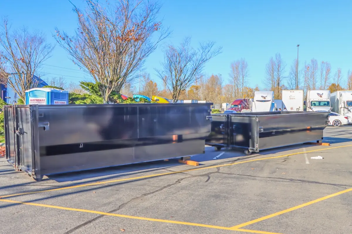 Professional dumpster rental service with roll-off container on residential driveway in Bulverde